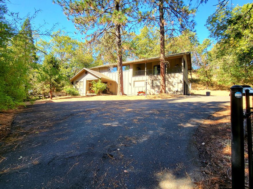 This end of street home has private entrance, paved parking and privacy.  Enter into your two story vaulted ceilings with living room and one bedroom downstairs and another bedroom upstairs with additional loft that can be walled off for your third bedroom.  Balcony off the master and accessible from upstairs with is fully covered.  Fenced property and low maintenance landscaping.  Make offer on this one as seller is almost moved out!