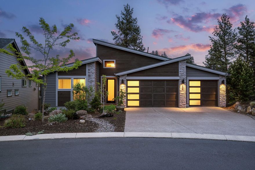 Own a piece of the Deschutes! The only residence in NW Bend's gated retreat with deeded low-bank River frontage—your private shoreline awaits. Positioned on the premier parcel, this sunlit, single-story home features soaring ceilings, an open floor plan and three serene suites. The primary suite offers a resort-style bath and oversized custom walk-in closet. A chef-inspired kitchen integrates smart appliances, statement pendants and a generous walk-in pantry. Outside, manicured gardens flow to the riverbank for peaceful seclusion. An unfinished walk-out level presents limitless potential, from expanded living space to private guest quarters. Adjacent to a nature preserve with exclusive North-South trail access and just moments from downtown, this unparalleled offering celebrates authentic riverside living with timeless appeal.