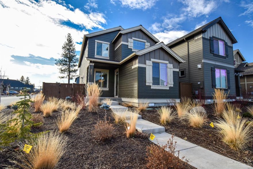 On a corner lot in The Bridges is this beautiful light filled home. Lot is fully fenced with a gate & is on sprinkler system. Knotty alder cabinets, SS appliances, open great room with gas fireplace, solid quartz counters throughout. Den/office on main level. Good privacy. Easy access to neighborhood park and to amenities that include pools, gym, & clubhouse.