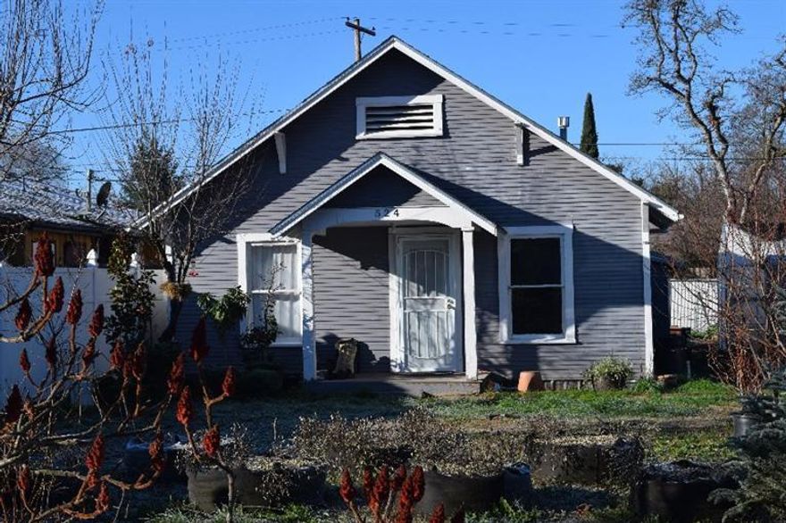 Owner financing...This charming home in a nice section of W. Medford and is a gardener's delight! There are tons of character and charm in this home including beautiful hardwood flooring throughout. There is a large backyard including many raised garden beds, and also, good parking all around including RV parking if needed. There are greenhouses that stay with the property, and all areas are on a drip system for easy watering. There are lots of wonderful fruit trees on the property for summertime enjoyment. The home is gas heated. Owner will finance with a small down payment.