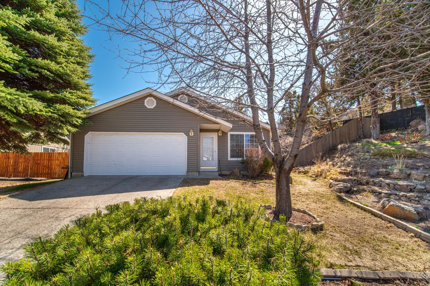 If you are looking for privacy in town this property is for you !  Park like setting in your back yard.  Located on the NE side of Bend. Tiled counter tops, backsplash, wood floors, and AC are a few of the features this home offers.
 3 Bedrooms
 Two bathrooms
 Two car garage
Easy to maintain smaller sq ft home. Would make a great rental or primary residence.