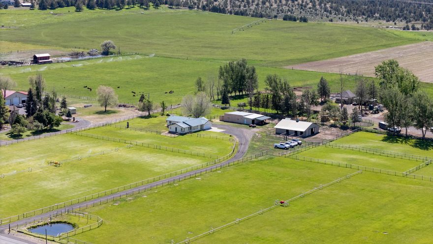 Welcome to your Central Oregon retreat - 9.89 acres of usable land with 8.9 acres of COID water rights, ideal for livestock, hobbies, or creating a dream rural lifestyle. The inviting 2,062 sq ft ranch home includes 4 bedrooms, 3.5 baths, and comfortable living spaces including a living room, dining room, kitchen, and family room. An attached 2 car garage adds everyday convenience. Horse and livestock owners will appreciate the barn with runs, thoughtfully designed paddocks with automatic waterers, and strong no-climb fencing with top rail. A versatile shop/equipment storage building with dog kennel and yard completes the setup.
Just minutes from the Deschutes River, public land access, and close to Redmond, this clean and move-in-ready property delivers both tranquility and accessibility.