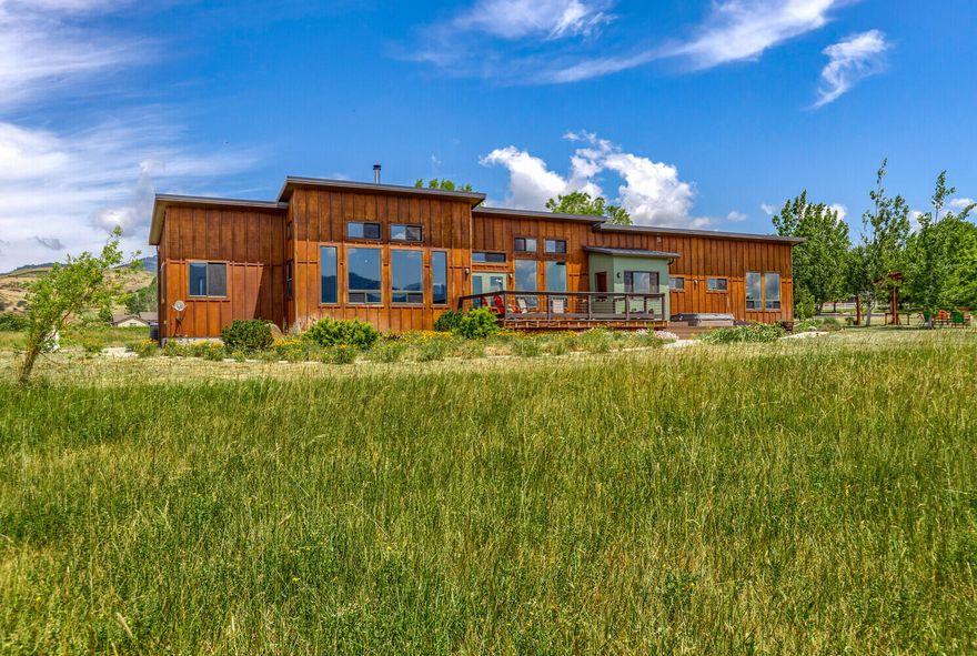 Come experience this magical property for yourself! Located just minutes to downtown Ashland, this pastoral 10 acre parcel boasts some of the best views around! Enjoy 360 degree views of Pompadour Bluff, Pilot Rock, Grizzly Peak and a stunning view of Mount Ashland and the quaint town of Ashland. Marvel at the ever changing skies with rich, blue backgrounds, dramatic white clouds and pink sunsets in the evenings. The main home was planned with all these views in mind and completed in 2009. It features a modern, single level design with clearstory rooflines and tall windows, framing the views magnificently. The warm living room includes a Danish wood burning stove. The primary suite has dual vanities, a large two-person tiled shower and a spacious closet. The opposite wing features a bedroom, an office and a north-facing, light filled art studio. In addition, there is a detached 587 SF studio with an enclosed office featuring the same fabulous views. Don't miss out on this opportunity!