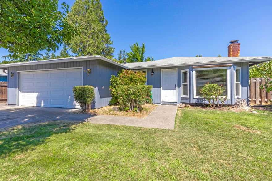 Charming 3 bed, 2 bath home on a 6,534 SqFt lot w/ RV parking, & a fully fenced backyard. Enjoy gardening in your own lg dedicated plot w/an automatic sprinkler/drip system. Relax in the hot tub or unwind on the covered patio & deck. The 2-car attached garage features a new door & opener. Inside, you'll find a cozy woodburning fireplace, bay window w/seat, & vinyl windows. Stainless steel fridge, microwave, & stove included, along with a built-in dishwasher.  New TRANE HVAC system & 1-year First American Home Warranty included for peace of mind. Don't miss this adorable home!