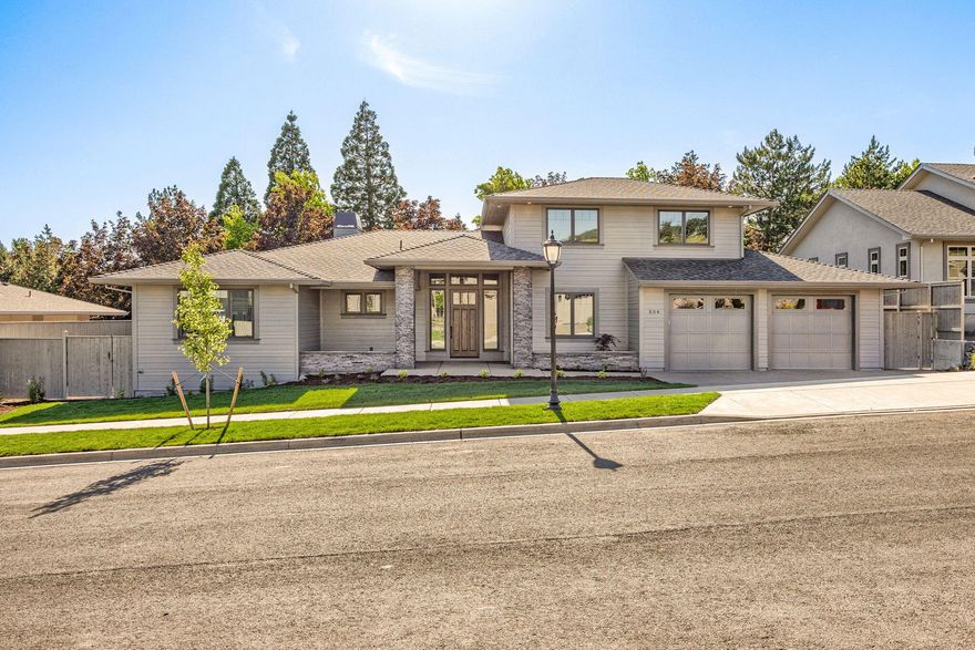 Discover refined living in this stunning contemporary home in the prestigious Summerfield subdivision. With exceptional curb appeal and modern elegance, this thoughtfully designed residence features 4 spacious bedrooms, 2.5 luxurious bathrooms, and a versatile upstairs bonus room—perfect for entertainment or relaxation.  The main level hosts all bedrooms, including a serene primary suite with a spa-inspired bath, floating tub, walk-in shower, double vanity, and large walk-in closet. The open-concept kitchen and living area impress with a floor-to-ceiling tiled gas fireplace, custom built-ins, premium KitchenAid appliances, quartz island, and soft-close cabinetry. Vaulted ceilings and expansive windows fill the space with natural light, complemented by rich hardwood floors and elegant tile finishes.
A generous two-car garage includes an extra 12.5' x 15.5' shop space, ideal for storage or projects.   Enjoy the nearby Summerfield Neighborhood park with playground and pickleball courts.