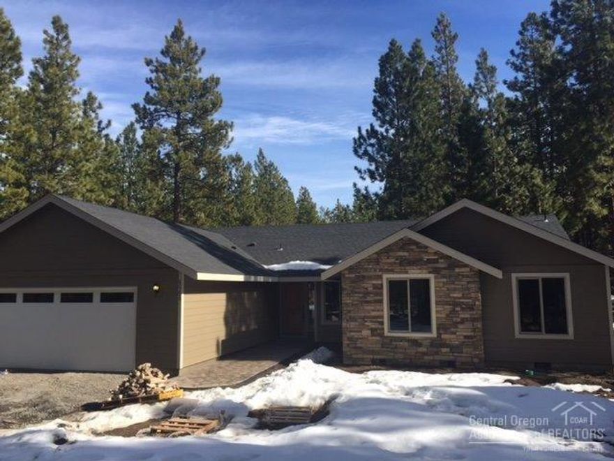 New construction on .5 acre lot near NATIONAL FOREST. Single level w/large, vaulted great room, slate entry, wood floors throughout kitchen & great room. Stone propane fireplace. Bright kitchen w/granite countertops, stainless appliances, alder cabinets & doors. Travertine throughout master bath. 2car garage w/side RV/Boat parking & room for a shop. Minutes from Sunriver, park & boat ramp on Deschutes. Close to Mt. Bachelor & Cascade Lakes. Still time to pick colors/change finishes in this home.