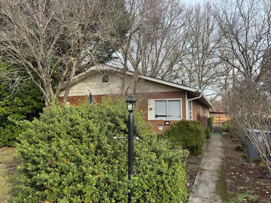 ***SHORT SALE*** Over 1900 sq feet of living space. Good size living room with fireplace, open kitchen with dining area and small breakfast area. Family room could be converted to the master bedroom with a full bath, if desired. Three bedrooms are located at one end of the home, with one bedroom converted to a large utility room. This ranch home has alley access for off street parking. Backyard has covered patio, small storage area, and shed. Bring paint, hammer, along with your imagination, and start creating!