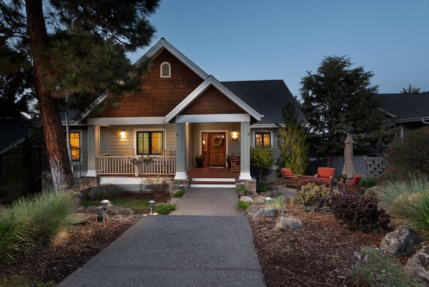 Craftsman style home with contemporary features. Great Room with vaulted ceiling, gas fireplace, large windows allowing in abundant light. Spacious Kitchen with Cherry cabinets, slab granite counters, hardwood floors, commercial 5-burner gas stove and custom lighting. Dining area that features a custom built-in with wine refrigerator and French doors leading to large back deck with eastern views. Primary Suite on main level with vaulted ceiling and access to back deck. Primary Bath with jetted tub, large walk-in tile shower, heated tile flooring and walk-in closet with built-ins. Private Guest Suite on lower level with built-in Murphy bed and access to outdoor patio. Convenient main level Laundry Room. Front paver patio for entertaining. Spacious 3-car garage. Fenced area on side of home. Great NW Bend location with convenient access to the Parkway, shopping and restaurants.