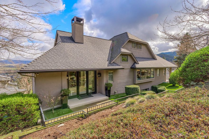 Imagine waking every morning to spectacular sunrises & the beauty of the valley with panoramic views from every room in the house. Or at dusk, the magic of sitting on a Shakespeare inspired veranda overlooking the city & Elizabethan Theater on perfect summer evenings as the lights slowly begin to appear. A Dream Team designed & built this dramatic home featured in Distinctly Northwest Magazine & selected as a venue for the Rogue Valley Symphony's ''Digital Journey''.  Located on a cul-de-sac above the blvd ½ mile from the Plaza, the design is timeless, soothing & European with a focus on art & extraordinary views. Everything is oversized & a bit grand, 10'+ ceilings, 8' doors, charming glass/chicken wire transom cupboards, a giant copper range hood before a wall of windows, 1600 sq ft of Italian ceramic tile, hand whitewashed Swedish Gustavian beams, a lovely 1110 Sq. Ft. legal, rentable in-law apartment. You will find many additional features during your viewing. We welcome your visit