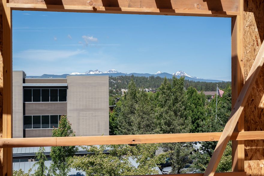 Take in the epic panoramic Cascade Mountain and Old Mill views from lot 1 at Arrowood's Eight in the heart of the Old Mill District. Just a stone's throw from The Box Factory, Crosscut, Crux, The Shops at the Old Mill and a few blocks to Downtown Bend, this is a prime location with easy access to everything including shopping, dining, fitness, Deschutes River, trails, concerts, night-life, and Hwy 97. Features include 3 bedrooms, an open great room concept, ample outdoor deck space, a lock-off fully permitted ADU or flex space downstairs with a private bath, all kitchen appliances and separate laundry. These stunning contemporary townhomes, decked out in designer finishes do not have any overnight rental restrictions including the City of Bend's 500 ft short term rental restriction. HOA amenities include exterior building and landscape maintenance. Incredible location for a luxury lock and go primary residence, vacation home or income producing property.