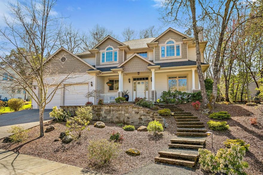 Stunning custom home in Meadow Wood. Grand entry with alabaster fixture and beautiful curved stairway. The cook will love the kitchen with gas cook top, stainless steel appliances, built-in oven and microwave, Corian counters, island, cherry cabinets, built-in desk, French doors to the patio and beautiful Red Oak floors. Formal dining room, living room with wood burning fireplace, 9 foot ceilings and custom Hunter Douglas blinds throughout. Family room has gas fireplace, ceiling fan and perfect for entertaining family and friends. Five bedrooms with exquisite master suite with soaking tub, dual sinks, tile floor, separate shower, walk-in closet and gorgeous mountain views. Laundry with utility sink and cabinets. Low maintenance mature landscaping on .29 of an acre; drip system, 700 sf of Trex decking and pergola deck cover. Upper deck to relax and enjoy the views. Oversize two car garage is 725 s.f. with shop area. Convenient location; close to shopping and hospital.