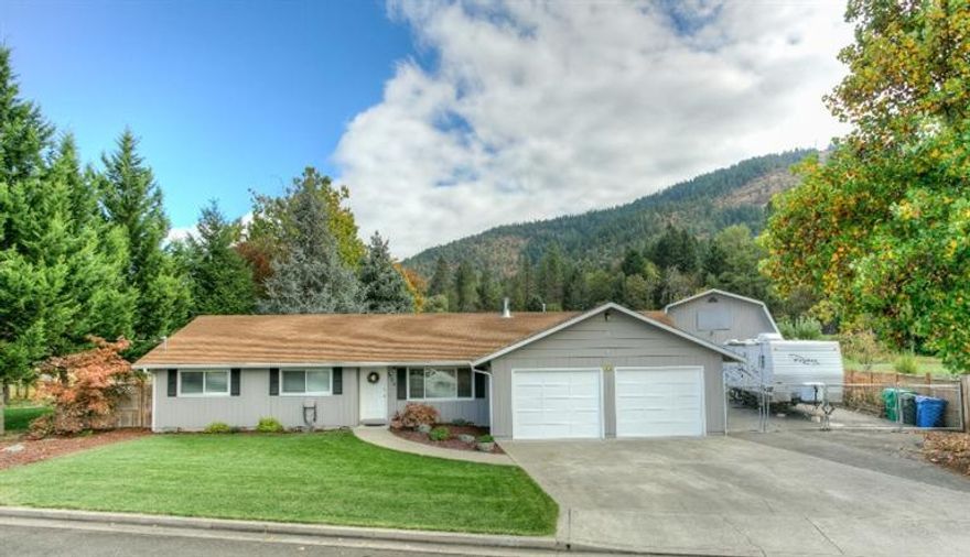 Located in the City, but feels like the Country... this impeccably maintained property offers the best of both worlds. Situated on an over-sized .22 acre lot, the main home features a warm and inviting living room with vaulted ceiling and large picture windows (& window seat) to take in the view. The freestanding natural gas stove offers ambiance and warmth on those cooler mornings/evenings. New windows and counter-tops throughout. The attached garage comes with a finished bonus room (10x23'8) used as an office, craft/sewing room, or additional bedroom. The detached garage features a spacious shop (22x20) downstairs, plus a 1-bdrm & 1/2 bath guest quarters upstairs. Do you enjoy entertaining? The park-like backyard with waterfall pond creates the perfect sanctuary for your guests to enjoy a glass of wine under the covered cabana/gazebo, or roast marshmallows over the fire pit. There's even a raised garden bed, detached garden shed, and plenty of room to park your RV and boat!