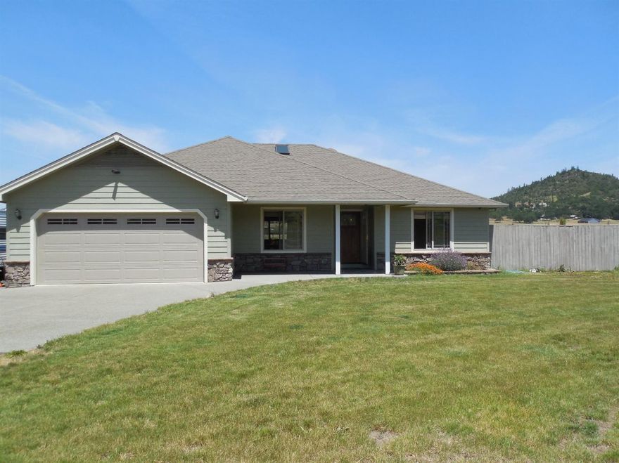 Remarkable custom home built in 2005. Nice use of hard wood and tile flooring thru-out, granite counter tops and custom shaker cabinets. Two of the three bedrooms are master suites with master baths - one with a private retreat or office that could service as a two family set up. Take advantage of the nice wood fire place to keep you cozy on those cold winter nights. There is nearly 600 sq. ft. of covered back patio for entertaining or relaxing. Craftsman shaker doors thru-out, 400 amp service in the garage and great views, some of snow capped Mt. McLoughlin. This home is nicely located looking out across the nearly 20 acres of EFU land. Room to do what ever one might wish, ranch - cattle or horses, garden or farm. Property has two wells, one being over 35 GPM (per well log) with a 2000 gallon holding tank set up for irrigation. 4 stall barn, with room for hay storage and tack room. Call and schedule you personal tour today. All information deemed accurate , but not verified. Buyer to