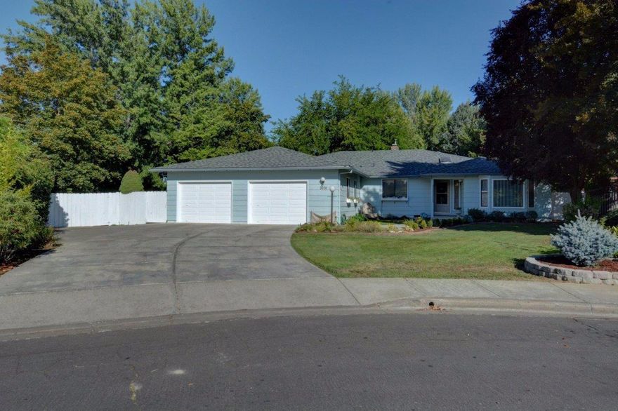 Minutes away from RRMC, this lovely 4 bedroom and 2 1/2 bathroom home is at the top of a quiet cul-de-sac. The LARGE .54 ACRE LOT, with mature shade trees, fruit trees, grapevines and a big garden area, has the feel of country living--insulated from the rest of the world. Upon entering this W. L. Moore home, an inviting formal living room and dining room flow off to the right. A spacious kitchen with a large eating area welcomes the whole family to gather at mealtime. An impressive floor to ceiling gas fireplace and a stunning built-in bookcase make the family room/great room a comfortable space to watch movies or visit with guests. Just off the master bath, a hot tub room opens to the covered porch for your privacy and convenience. The large laundry room has plenty of storage including a wash basin, and the HUGE attached garage is wired with 220 electrical service for the handyman. THIS HOME IS A MUST SEE! Call now to schedule an appointment.