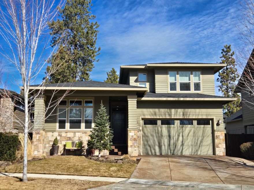 Desirable Aspen Rim neighborhood just across the street from the community park, pool, pavilion and close to the Deschutes River trail access. A well-appointed 4 BR Northwest Prairie style home just minutes from the Old Mill District, shopping, movie theater & restaurants. Expansive floor plan offers 3 BR's downstairs, good sized flex/loft area, 4th BR and a full bath upstairs overlooking the park. The gorgeous center island kitchen, quartz countertops, breakfast bar, stainless appliances, dual dishwashers, built in wine fridge, plenty of cabinets & counter space. A fantastic great room w/ high ceiling, gas fireplace and eating area make it incredibly appealing and wonderful for entertainment. The main level primary suite offers a big walk-in, floor to ceiling tile shower, quartz counter tops, dual vanities, tile flooring, large soaking tub and walk in closet. Relax under the covered outdoor paver stone patio, fully fenced backyard, well-manicured landscaping, underground sprinklers.