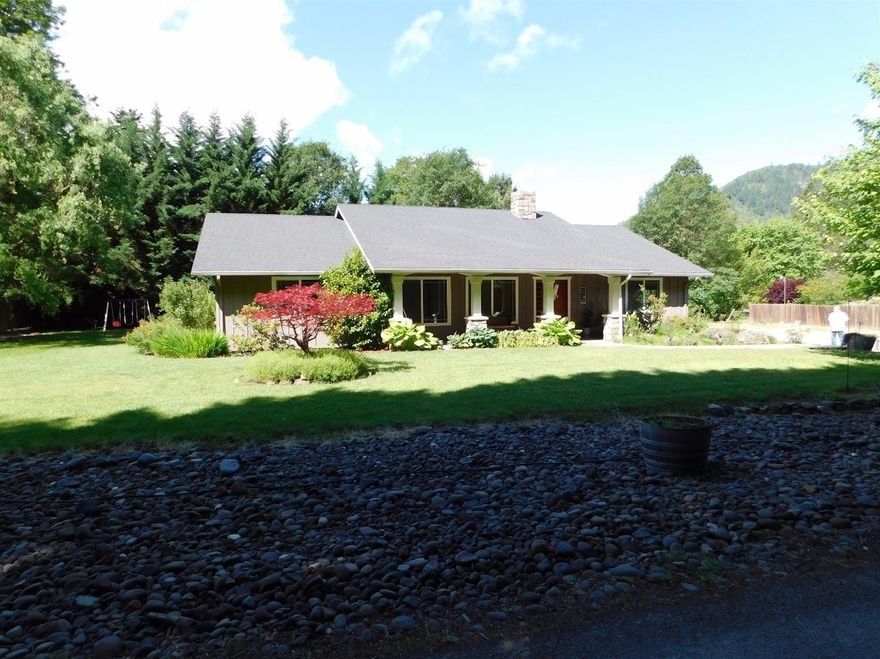 Custom built home on level .99 acre lot near the Rogue River. Single level 3 bedroom., 2 bath home has 4-car attached garage w/1/2 bath, plenty of shop area. Bright, gorgeous kitchen with custom oak cabinets, granite counters & breakfast bar. Living room is plumbed for (gas) fireplace with chimney in place. Home also features a central vac system. Covered front porch provides an inviting way to greet guests, and large covered back patio is great for entertaining and overlooks the beautifully landscaped, private backyard. There's plenty of room for parking, adding a shop or RV parking.