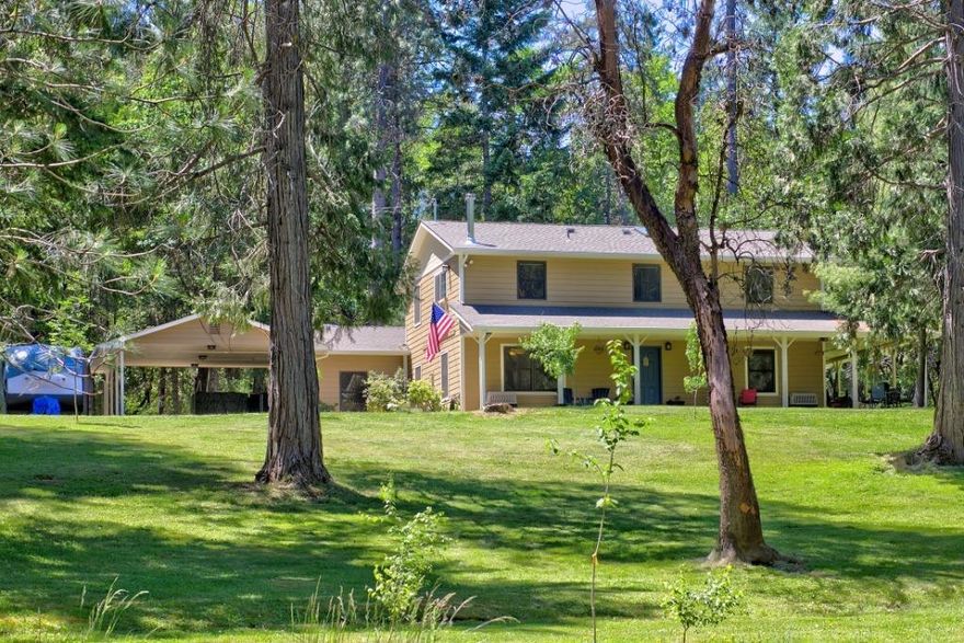 Welcome to Country living! Tucked back off the road, gated & fenced, is your own private 5.62 acre wooded oasis w/ a 2,996 sf home! Completely remodeled in 2017. Sit in your rocking chairs on the front porch, relaxing to the breeze through the trees. Tile and laminate flooring run throughout. Family room is separated by French doors, full bath, 2 skylights, gas stove & separate entrance. Large Country kitchen w/ plenty of counter space, & walk-in pantry. There is a living room, dining room, and office/bedroom on the main floor, all other rooms upstairs. Master suite has everything you need-vaulted ceiling, fans, and tile shower with Bluetooth speaker. Wonderful laundry room with soft close cabinetry, guest bedroom and full bath complete the upstairs. Outside you will find 22 raised garden beds, fruit trees, berry bushes, 4 stall carport, barn w/ ducks, rabbits, & chickens, detached 1 car garage & attached 2 car carport, backed by BLM.