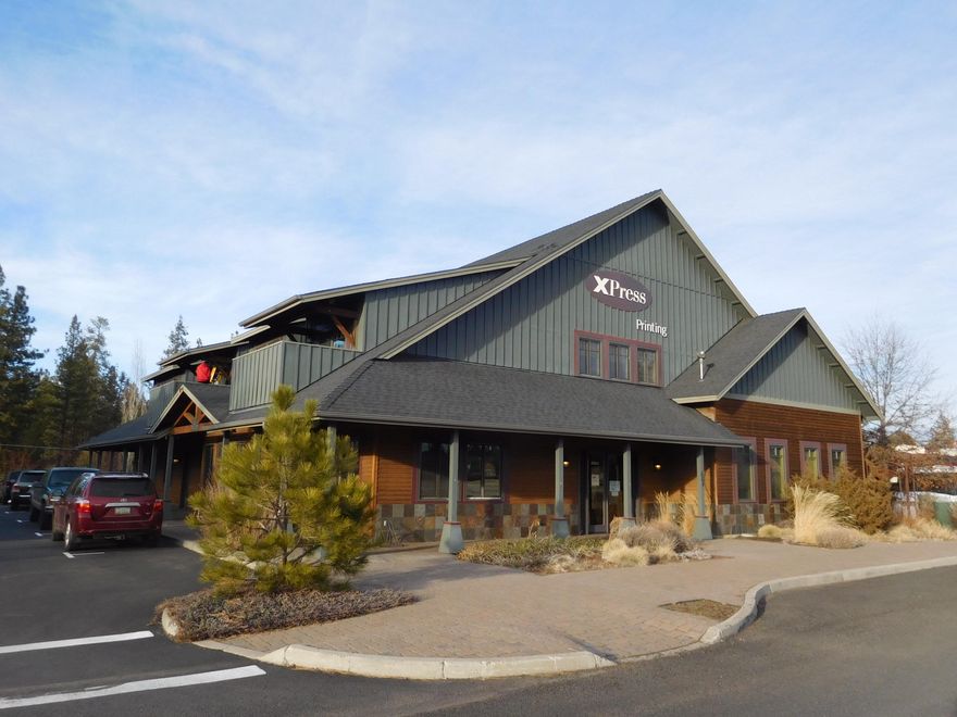 This is a sale-leaseback agreement. Owner has operated a successful printing business from this location for over 15 years. In addition to the commercial tenant there are also two one-bedroom rental apartments on the second level. Property is in excellent condition. Building is two story commercial with a total gross usable area of 8356 square feet. First level space is currently configured as commercial printing and office space. The space can be adapted to accommodate a variety of uses. The second level space consists of residential housing (2 one bedroom apartment units). The second level also includes 956 square feet of archive and record storage space. Market value based on 6.5 cap rate.