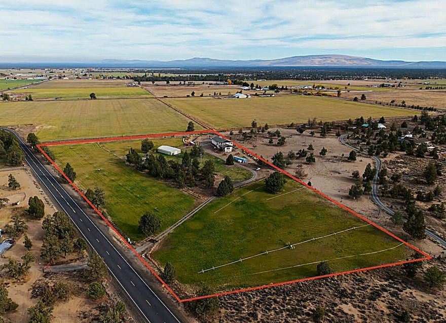 GREAT LOCATIONMinutes from local conveniences,this custom built home offers 3,112 sq ft of quality living on 9.9 acres w/7 irrigated & panoramic mountain vistas on a private setting.The heart of the home is a large great room w/pellet stove & stylish kitchen w/breakfast bar & DR area.A 1st floor primary suite w/luxury bath, new jacuzzi tub,heated floors & walk in closet. Upstairs offers 2 spacious bdrms,full bath,additional media room w/partial kitchenette & another large bonus room for multiple options. Attached 'oversized'' 4+ car garage w/7&#8209;ton rotary car lift inclded w/shop area.Expansive decks,fenced yard, pond & a 2,160 sq ft drive&#8209;through poll barn makes this a ranchers dream!Storage galore for tractors, ATVs & toys.OK for cattle &/or horses.2 hay producing fields w/hand & wheel lines included.New energy star heat&#8209;pump A/C, Cistern w/dual pumps, copper gutters & reliable high&#8209;speed internet.Seller offers up to $12K to Buyer for rate buydown or CC. 1 year Home Warranty Included