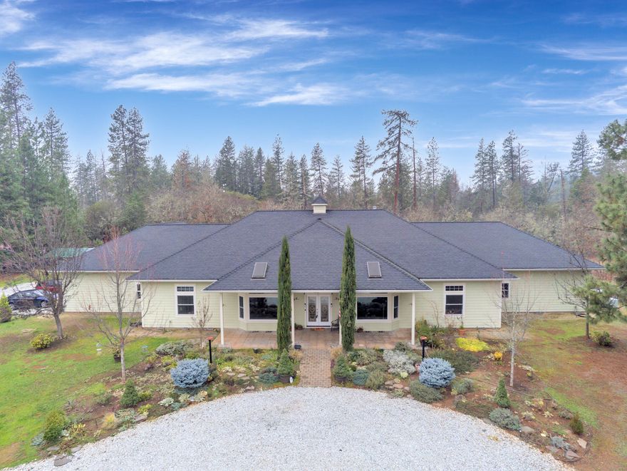 If you are searching for an upscale, single level home with plenty of space, on a couple of well manicured acres, this is the one! This beautiful country style estate offers so many wonderful amenities, in a setting that just can't be beat! Beginning at the stately entry, you are surrounded by the highest level of quality and design. The living area is warm and inviting, with lot's of natural light. Glistening quartz, tile and hardwood floors, granite counter tops, custom cabinetry and accents offer luxury to the discerning Homeowner. Custom built-ins and upgraded appliances are on the extensive list of details this home offers. Two separate living areas and a large formal dining space are adjacent to the big kitchen and eating nook. Newly remodeled laundry room with brand new cabinets, built in desks and an abundance of storage. The primary suite is huge!! The 4 car garage is finished with 220 power. Backed by 40+ acres of BLM land! Hiking trails ready for you out your back door!