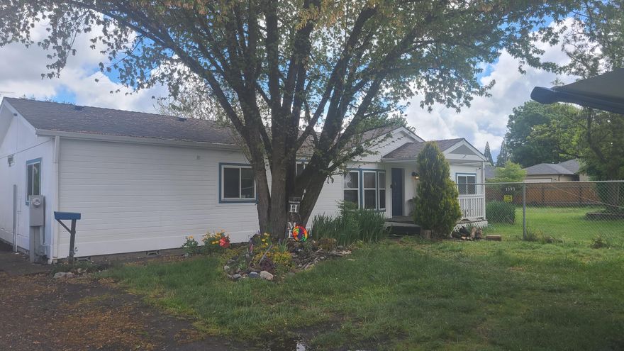 Looking for a home with over 3/4 of an acre lot with future development possibilities or a multi family set up?  Located in SW Medford, at the end of the street, this manufactured home is 1,620 sq ft with a split floor plan.  The master bedroom with bath and walk in closet on one side and 2 bedrooms and a bath on the other, along with an oversized laundry room with a sink and storage. The large living room, dining area and kitchen with island and built in table are in the center of the home.  Nice decks on both the front and back of the home. There is an oversized, detached double garage and an 8' X 10' shed.  Zoned SFR-6, this is a great opportunity for investors, builders, developers or a multi family set up - buyer to check with the city to see all the possibilities. Would also make a great home for someone who just wants a larger lot! There's even a greenhouse and chicken coupe!