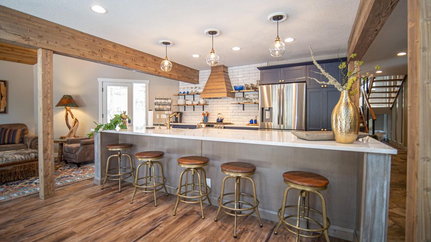 Beautiful updated home located in the heart of Sunriver! Spacious open floor plan is perfect for large groups. Gourmet kitchen w/ solid surface counters, farmhouse style sink, stainless appliances and gas cooktop. The main floor includes kitchen, great room, dining, 1 bedroom and 1 full bath (not attached). Upstairs you will find a loft with gas fireplace, 2 bedrooms with attached baths, full bath/laundry room, plus bonus/bunk room with custom built in bunk beds. Great outdoor deck space facing common area. 2 car garage w/ lots of storage and/or extra flex space for workshop or workout room. Recent updates include: New roof, furnace, A/C, exterior and interior paint, moldings, doors, windows, appliances, flooring, kitchen, upstairs hot water heater, etc. Start making memories in this Sunriver home!