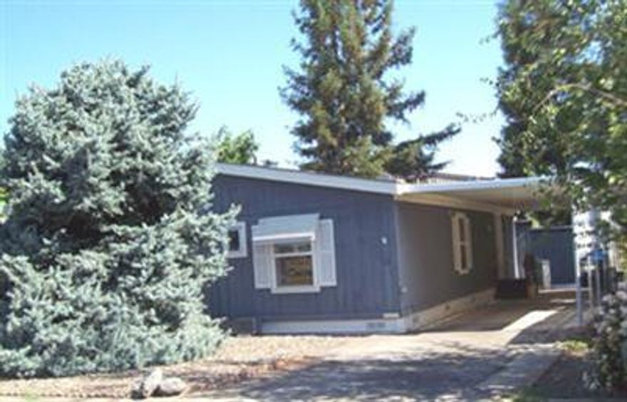 Huge Reduced Price:: Owner Carry:: Great Buy in Glenwood Mobile Estates. Split floor plan. Vaulted ceilings. Kitchen has open counter to dining room with double sided glass doored cabinet above. Floor to ceiling pantry. Large walk-in closet in master bedroom with dressing table and vanity opening to master bath room. The water heater is new. Handicap ramp at front door. Included are two storage sheds and Home Warranty. Glenwood Mobile Estates is a 55+ park with a large community center with poolroom and in-ground swimming pool. Close to public transportation.