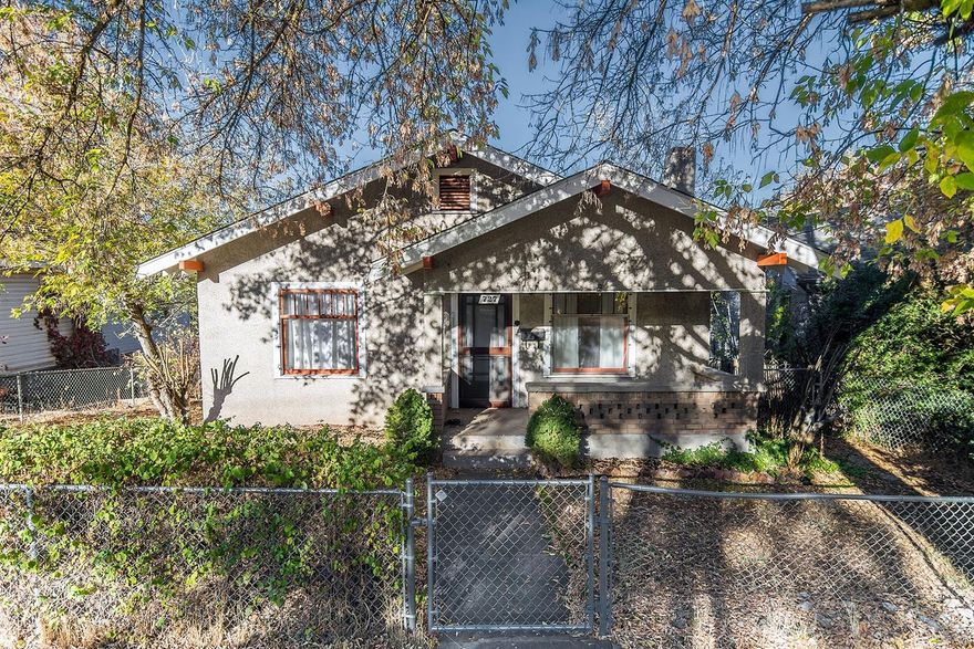 If it is Old World Charm you want here it is. You will enjoy a beautiful fireplace with original, built- in book cases and a dining space with original built China Hutch. This home also features 3 bedrooms, 2 of which have built in closets. This home features many original fixtures. The kitchen is light and cheerful and there is a deck off the mud room/laundry room in the back of the home. There is a carport, and garden space in the back of the house. There are extra parking spaces at the back of the house. The partial basement is ideal for storage.