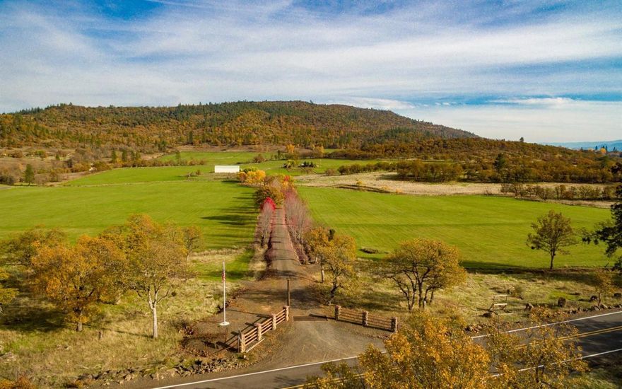 Reese Creek ranch is a masterpiece of beautiful and perfectly architected hay and grass fields. The property consists of 197 acres and backs to vast BLM holdings and boasts over 80 acres of irrigation water rights. The property has an excellent mixture of high ground winter feeding oak Savannah hills and gravity flow irrigated pastures. The farm is perimeter fenced and could easily be converted into an equestrian estate or cattle operation. For those looking for a private estate with multiple homes there are 2 additional homesites that can be developed on the property with several absolutely stunning potential building locations overlooking a picturesque year round pond. The views are splendid! There are also several springs on the property. The farm has a modest but clean 1950 3 bedroom 1 bathroom farm house. Other outbuildings include a large shop (60x40) with RV parking and multiple bays, large newer hay barn (100x60), vintage dairy barn building with water and electricity (36x24) a