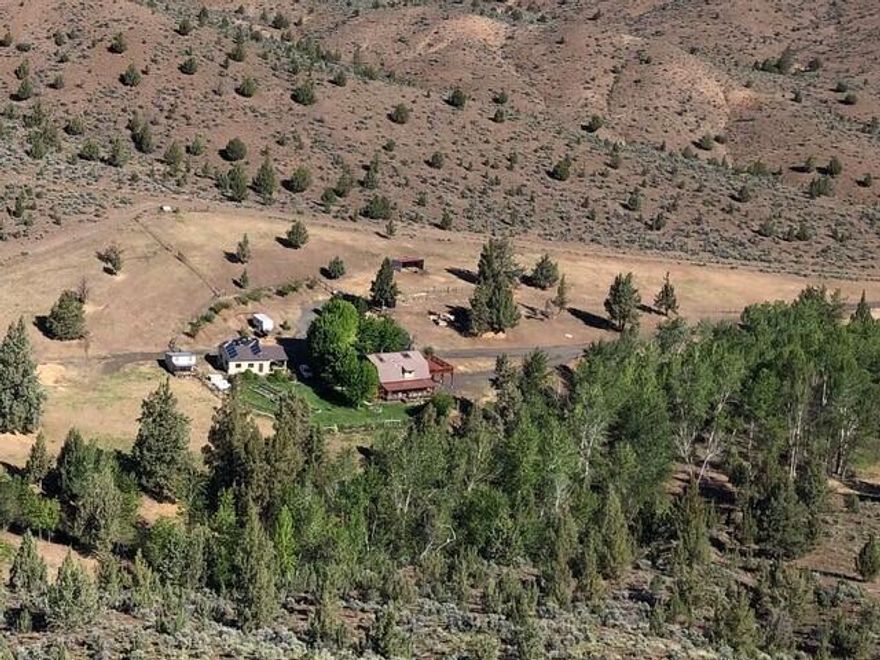 A very unique property on 80 private and peaceful acres. No neighbors. Year around Cottonwood Creek runs the length of the property which borders BLM and private grazing lands. The charming 3 bedroom, 2 bath home is off-grid but there is no need to rough it here-the professionally installed solar system with back up generator allows for t.v., microwave, dishwasher, and washer/dryer. Beautiful wood ceiling beams and pine throughout. Updated kitchen with new, high-end appliances. Fiber optics/high speed internet. 28X24 shop with equipment bay. Fenced and cross-fenced for your animals. Qualifies for 2 LOP cow elk tags. Large yard landscaped with raised beds, roses, honeysuckles, elderberries, grapes, and fruit trees. Four miles from the town of Dayville. Two easy miles from Highway 26.