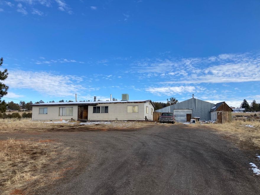 Looking for a fixer with some acreage? This property is in a good location on Hwy 140 about half hour from Klamath Falls. Total of 7.79 acres mostly sage brush with couple ponderosa pines and junipers. The shop is 864 sqft, has sliding door in the back, partial concrete pad with the remainder gravel. The 1977 3 bedroom, 2 bath manufactured home is in poor condition. The back yard is fenced with some fruit trees.