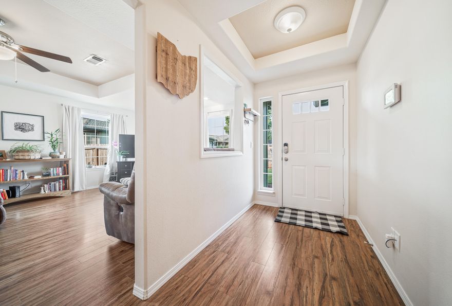 Step into this amazingly well-maintained single level home with an abundance of natural light. Enjoy the relaxing breeze from your ceiling fans perfectly located in your coffered ceilings. Start your coffee in this open kitchen with stainless steel appliances and the perfect amount of open counter space. Or simply relax in your private fully fenced backyard with a large, covered deck. Noted features: New landscaping in 2018, New windows in 2018, New roof in 2018, smart home furnace and alarm control, finished 2 car garage, Hot tub hook-ups & platform, plus so much more!