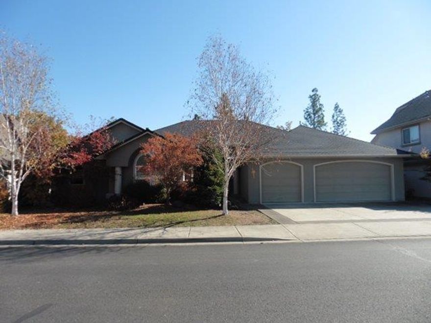 Luxury with awesome golf course views! Wonderful golf course property offers a large 3 car garage and back patio that overlooks the Eagle Point Golf Course. Step inside to this split floor plan that offers a huge maser suite complete with double vanity, jetted tub and large walk in closet. Enjoy a gigantic living room/great room with soaring ceilings, a wall of windows and a fireplace. Well appointed kitchen offers tons of storage and stainless steel appliances. 2 more guest bedrooms and a separate office with fireplace round out this attractive property.