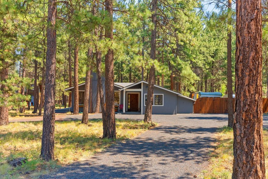 Discover the charm of mountain living in this sweet single level 3-bedroom, 2-bath home located in the desirable Tollgate neighborhood—just minutes outside the city of Sisters. Set on a spacious lot with a large, private backyard, this home offers room to relax, garden, or entertain under the tall pines. Inside, enjoy a warm and inviting layout filled with natural light and thoughtful updates. An artist's studio provides the perfect space for creative pursuits, a home office, or guest overflow. Ideally situated for year-round recreation, this home is close to Black Butte Ranch, Hoodoo Ski Area, and the sparkling waters of Suttle Lake. Whether you're seeking adventure or quiet retreat, this location offers the best of both worlds. Residents of Tollgate enjoy access to community amenities including walking trails, pool, tennis courts, and open green space—all within minutes of downtown Sisters and the beauty of the Central Oregon Cascades.