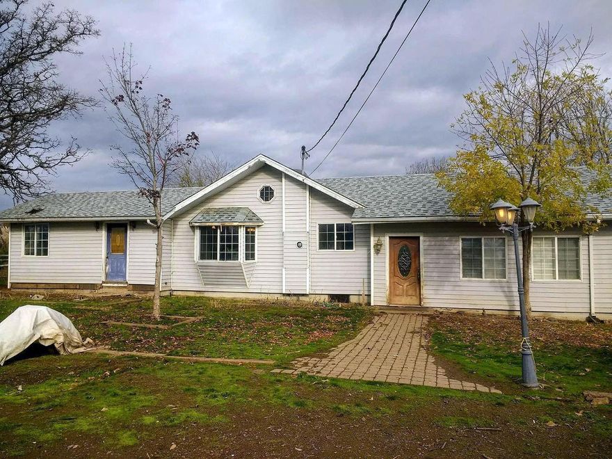 This home and land has so much potential. With 11 flat acres, property is fenced, cross fenced, has a pole barn, a work shop w/office and lots of storage. Has had some updated painting. Home needs some TLC. Large price reduction...Seller is motivated and willing to look at all offers.