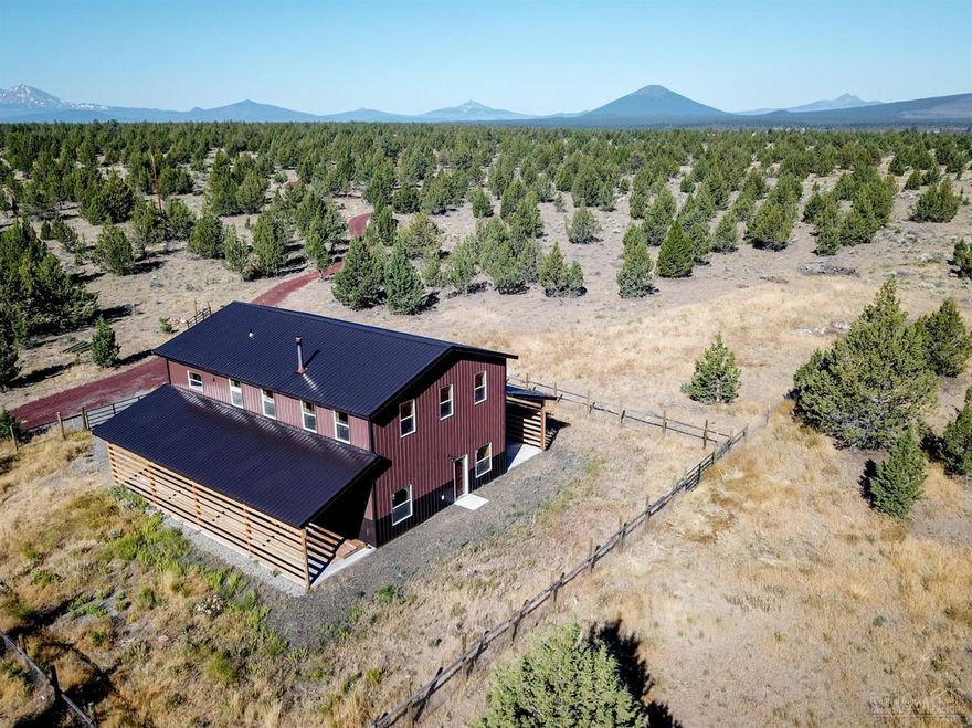 42 acres with 365 degree beautiful Mtn views! Unique to Central Oregon because it's surrounded by BLM land on three sides, making it a quiet and peaceful retreat for hunting, fishing, or horseback riding. The 1700 sq ft shop has living quarters on the 2nd story with beautiful custom reclaimed cabinets in the kitchen and bathroom. Below is an extended length single car garage with laundry and flex rooms. A second 900 sq ft building is fenced and ready for horses. This is a gorgeous one of a kind property that you will not want to miss seeing!