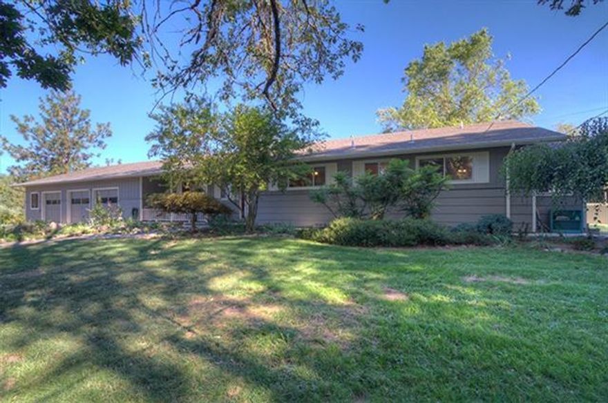 Fantastic piece of property with a great, large home. Gated entrance with paved driveway, fenced and x-fenced, large irrigated pastures, barn, studio, large 3+ car garage/shop with drive thru bay and tons of storage, fruit tree orchard and garden, pond and creek, GPID irrigation services. This is an amazing property with a lot to offer. The home offers 2000+ sf with 3 bedrooms and 2 1/2 baths, birch cabinets, some hardwood flooring, fireplace with pellet stove insert, heat pump with central air, 9' ceilings, lots of windows and mountain views.