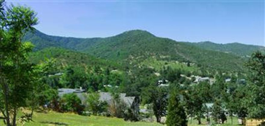 Marvelous view lot overlooking a serene wooded valley, minutes from downtown and Lithia Park. Adjacent to acres of city owned hiking trails with hilltop panorama over looking Ashland with views to Medford and surrounding mountains. Site is ready to build with solar waiver and planning dept permission for 4 bedroom home located on quiet cul-de-sac in an area of upscale homes.