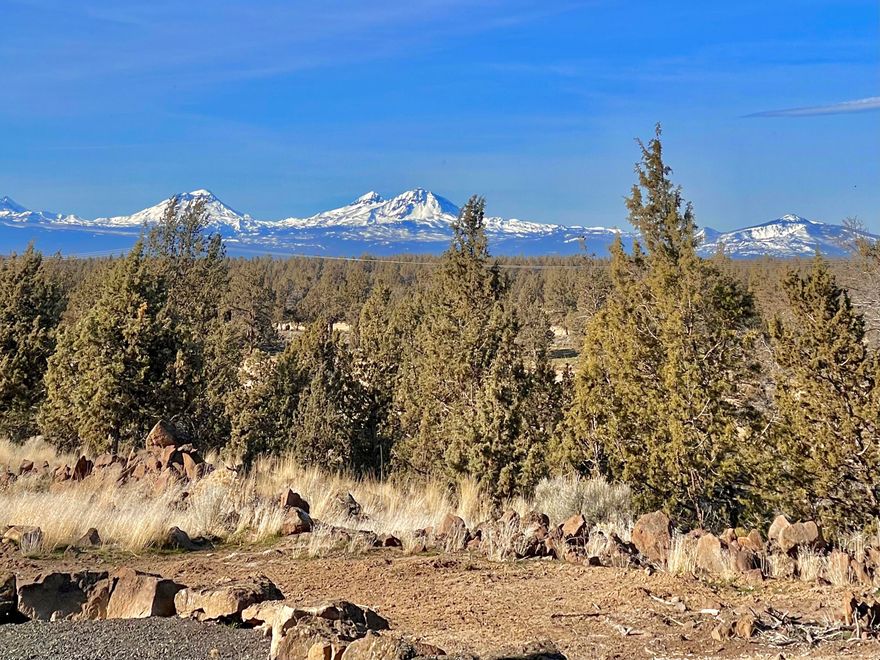 Absolutely gorgeous home in the contry!3 bed, 2 bath, single level on almost 5 acres with AMAZING Cascade Mountain views!!This home has been completely revamped, New Engineered hardwood in the living room, Hallways and primary suite, New Quartz countertops in kitchen and tile in the baths, New interior and exterior paint, New composite decking on the NEW Covered Back Deck with lighting and Views galore! New propane Kitchen Range and fireplace in living room. There is a 20x40 Detached Pole Barn with an insulated 200 s.f. art studio behind the shop. Owners planted over 50 shrubs last summer with a new modern f\drip system you can control with your phone. New fenced garden area!! This will go fast! Show it today.