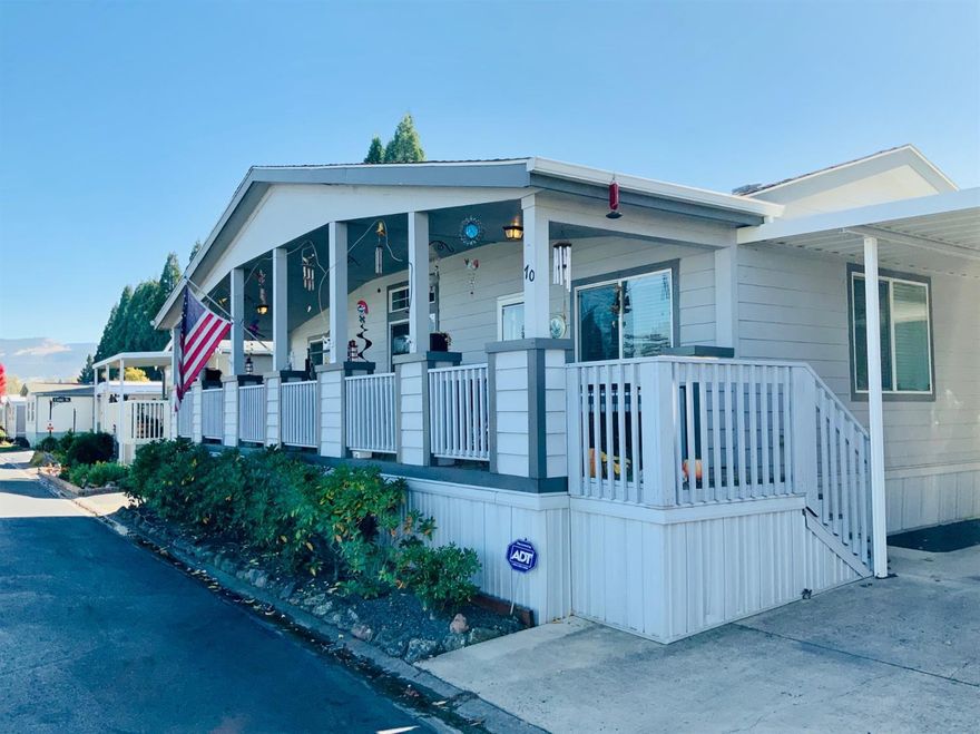 Charming home in popular family friendly park. Conveniently located, first home on the right as you enter Medford Estates. This well-kept 2006, 1600 SqFt, three bedroom two bath home is just what your looking for! Plenty of storage throughout the house, brand new water heater, walk-in pantry in kitchen, vaulted ceilings, master suite with walk-in closet, covered deck out front, covered patio out back, gated back yard area with 14x10ft shed, 3 car-carport and sprinkler system for easy watering. Monthly space rent is approximately $680. Utilities included in park rent are water, sewage, trash and park security. Park amenities include heated swimming pool, indoor spa, playground, basketball court, fitness center, clubhouse, laundry facilities and tennis courts. Schedule your showing today!