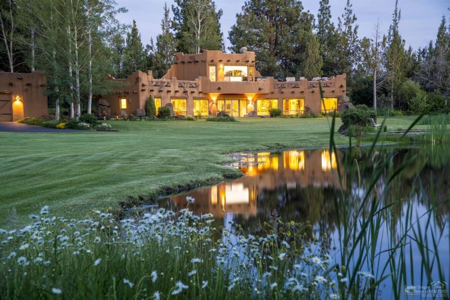 High Desert oasis in Tumalo with Cascade Mtn views! Enjoy peace and privacy from this authentic Pueblo style home in a setting that is impossible to match. The stunning landscape and wildlife await just outside your door with a meandering canal, ponds and greenery surrounded by pristine Wildlife Wetlands. Extensive landscaping with 2 acres of irrigation & underground sprinklers complete this secluded park like setting - offering the perfect tranquil retreat! Potential for horse set up or alternate homesite.