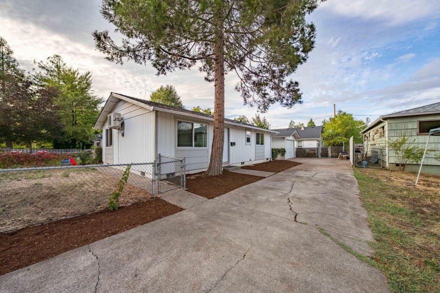 Exclusively presented for sale - 1036 West 12th Street, a clean, remodeled ''2-on-1'' income property in a quiet pocket of Medford, Oregon (the ''Property''). Efficiently sited on a 0.16-acre lot with multiple access points, the Property enjoys two fully separate homes on one lot with no shared walls. The front unit (''A'') has been recently gut-remodeled, with nearly every surface being re-done. Light and bright, Unit A is currently vacant, ideal for an owner-occupant or for a new buyer to place a tenant. Front yard, large driveway, and detached enclosed garage is private for unit A. The rear house (''B''), also underwent a substantial remodel in the past years, and is leased on a month-to-month tenancy at $1,400/mo. Roofs, exterior paint, driveway cleanup, landscaping, and much more has been fully refreshed and primed for new ownership to enjoy. Live in the remodeled house and subsidize your mortgage payment or add to your portfolio - contact brokers for more info!