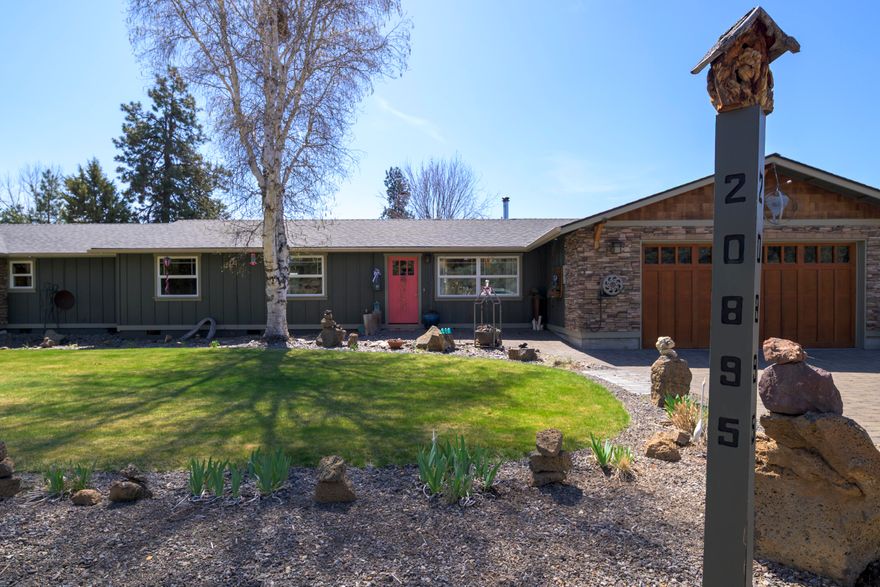 Built in 1977 and thoughtfully updated over the years, this well-maintained single-level home sits on a spacious 0.56-acre lot in desirable SE Bend. Offering 2,568 square feet of comfortable living, the home features 3 bedrooms, 2 bathrooms, and an open floor plan that's perfect for everyday living and entertaining alike. Inside, enjoy two fireplaces, a recently expanded kitchen, and plenty of natural light throughout. Recent improvements include a newer roof, fresh exterior paint, and a new hot tub—ideal for soaking under the stars. The property truly shines with a nearly 2,000 sq ft 3-bay shop, fully wired with 220 power—perfect for hobbyists, craftsmen, or RV storage. A brand-new asphalt driveway leads to the shop, with ample room for RVs, boats, or additional vehicles. Also includes a greenhouse, mature landscaping, and a private setting that's just minutes from local shopping, schools, and outdoor recreation. This SE Bend gem offers a rare combination of space, convenience and