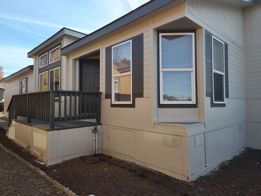 55+ Park in Desirable Suntree Village. This MOVE IN READY, 3 bedroom 2 bath 1542 sq ft home has it all, its been freshly painted inside and out, all new floors and blinds were installed, it's light and bright, has vaulted ceilings and a great lay out, living room has a wall of windows and decorative ceiling, kitchen has lots of cabinets and counterspace, a kitchen island and a sitting area with bay windows, a formal dining room with bay windows, a huge primary suite w/soaker tub, stall shower, separate his and her vanities and lots of cabinets, laundry room has a sink and lots of storage and includes the washer and dryer. Home has Carport with storage, patio, small yard and ramp, even views of the Cascade Mountains, all in walking distance to the New Larkspur Community Center, where you can swim and exercise. Must See! Wont last, make an appointment to view.