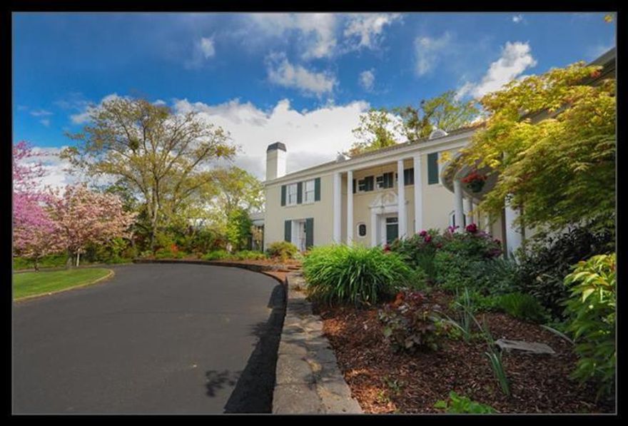 One-of-a-kind 1939 estate in Old East Medford is the original home of Harry Holmes, founder of Harry & David. The grounds and the 5,500 sq ft house were designed by celebrated architect Paul R. Williams, and are in impeccable condition. Current owners have renovated the house to maintain the historic look and feel while including modern features. The original overgrown grounds have been transformed into an oasis of plants blooming 9 months a year under magnificent native oaks, and include one of the Rogue Valley's first in-ground pools, a pergola, and a shaded flagstone patio. The 1.6-acre gated parcel is one of the largest residential lots in Old East Medford and is in turn surrounded by 19-acre Holmes Park. The grounds can accommodate 30+ vehicles. There is a separate studio for guests or caretaker. Views extend to Mount Ashland and the Siskiyou Mountains. This is a unique opportunity to acquire a historic and exceptional property in the heart of Southern Oregon.