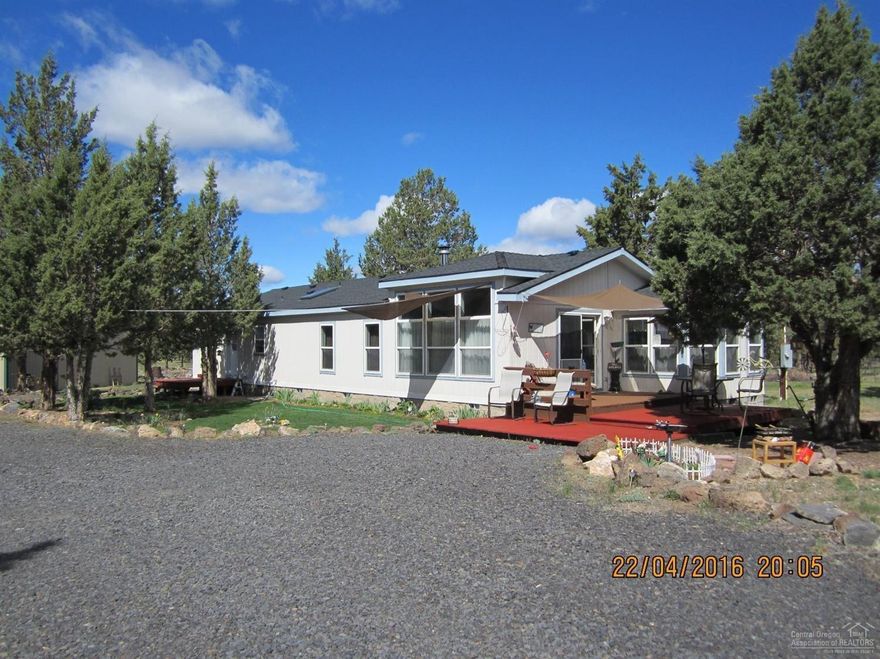 This is a very clean, well maintained home on just shy two acres. A new roof was installed in 2015, new landscaping has been put in, fruit trees planted, decks painted, siding caulked, hot water tank serviced and septic pumped in the last two years. Large Master Bedroom with soaker tub and his/her vanities. Very large Kitchen with a breakfast nook surrounded bywindows for tons of natural light.Three RV hookups and large 38x24 shop w/concrete floor and 220 power. Fully fenced with circular drive.