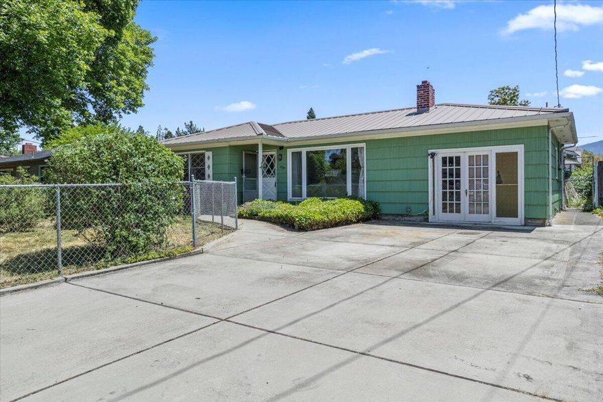 This delightful home is centrally located and situated on a nice, quiet dead end street. It features 2 bedrooms, 1 bathroom, and an additional bonus room that can be tailored to suit your needs. The front is nicely landscaped, and the large lot is fully fenced and offers alley access. The property features a large oversized driveway that offers an abundance of parking space. There is also a detached garage/workshop. Easy to show, call to schedule a showing today!