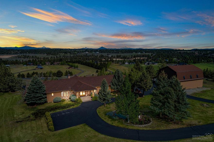 Gorgeous, single level home, is nestled in the middle of a 5.13 acre lot with 1.5 acres of irrigation. This home offers expansive mountain and pastoral views from every room. With 4 bedrooms, 4 full bathrooms, this 4253 sqft home has gorgeous beamed ceilings, a wall of windows for viewing the mountains, meticulously maintained grounds, all new SS appliances, new carpet throughout, and automatic blinds. This home has a huge kitchen, formal dining room, 2 marble fireplaces, marble shower and tub, along with new exterior/interior paint. This property has so much to offer with a three car garage, 34x44' (1575 sqft) shop that is complete with a loft, full bathroom, studio/bonus room, and an oil changing pit. This lovely Winston Ranch property in Tumalo will not last!