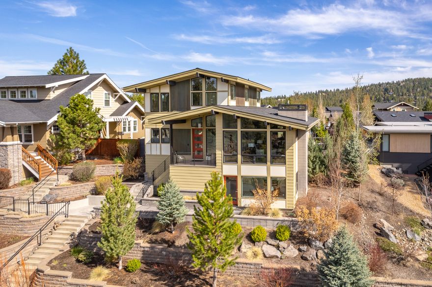 Located in the highly desirable neighborhood of Northwest Crossing, this NW Bend home offers the best of both worlds - easy access to Bend's amenities and your own private retreat with sweeping views of open space. With 4 bedrooms and 3.5 bathrooms spread over 2572 SF, this stunning home is perfect for full-time living or a relaxing Central Oregon getaway. The primary bedroom is conveniently located on the main level and accessible without steps from the garage level. The great room is a highlight, with vaulted ceilings and oversized windows showcasing views and natural light. The lower-level is versatile and can be a second guest suite, home office, or bonus room with private entrance. The upper-level has two bedrooms, a bathroom, and a loft area with views of Rim Rock park. Relax in the private backyard oasis, or enjoy the bustling Galveston Ave corridor just moments away. The home is also equipped with $20,000 worth of solar panels to keep utility costs low while helping the planet.