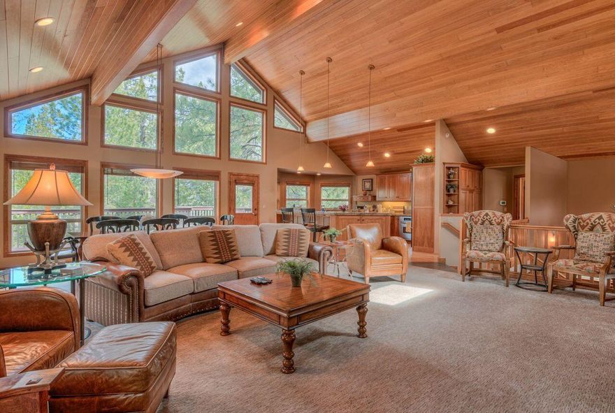 Experience the epitome of comfort and luxury at this stunning Sunriver home, the perfect gathering place for family and friends. As you step into the house, you are greeted with soaring windows that flood the home with sunlight, offering breathtaking views of the large, open common area. The property is designed to encourage socializing, with a spacious dining area and an additional breakfast spot making every meal a special occasion. The kitchen is a chef's delight, featuring granite countertops and an extra sink area that makes cooking a breeze. A rock fireplace adds to the elegance of the house, creating a cozy atmosphere that invites relaxation. The home features an elegant primary suite on the main level, offering a private sanctuary for the homeowners. An office with extra sound insulation provides the perfect spot for those who work from home. Outside, expansive decks and an accessible hot tub area provide the perfect setting for outdoor entertaining. # 24 McNary Lane